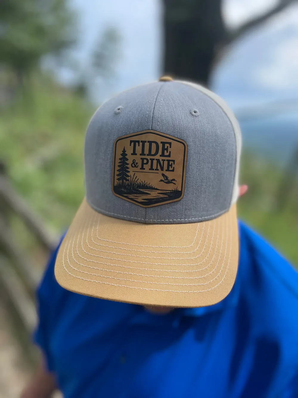 Duck on the Marsh trucker hat in an outdoor setting